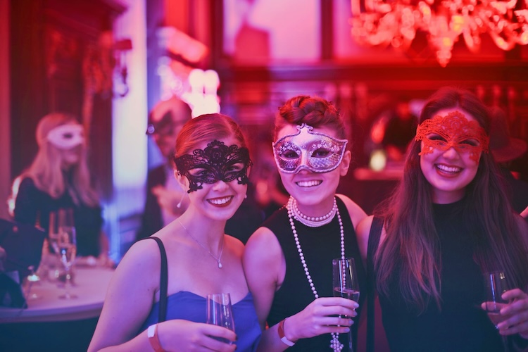 women wearing masks at event