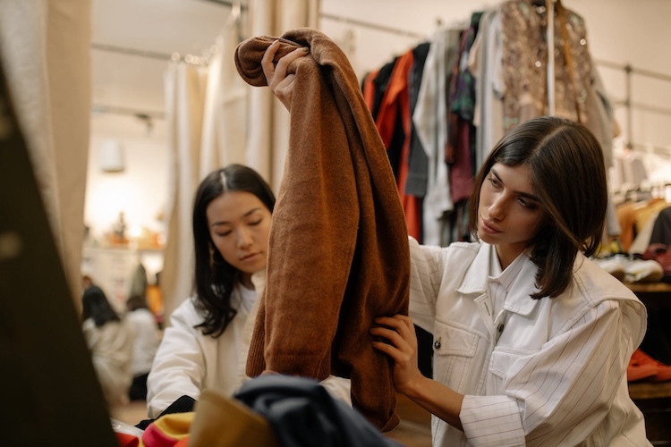 women at thrift store