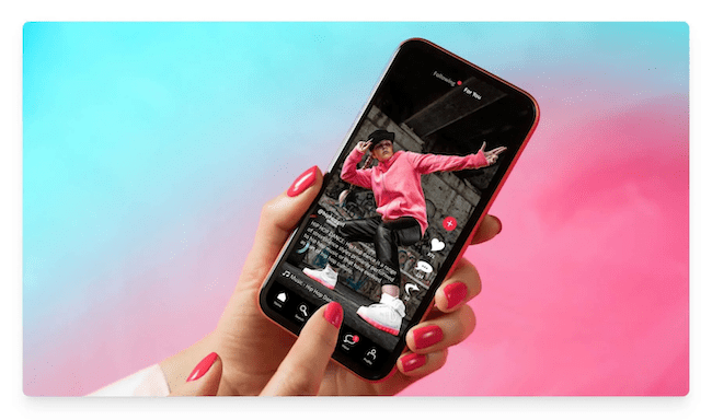 person holding phone with tiktok app