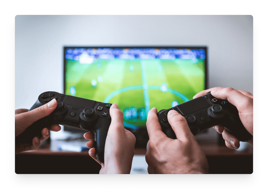 two people holding video game controllers