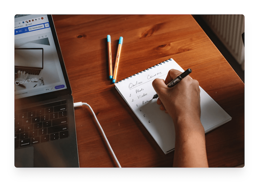 person taking notes for online courses