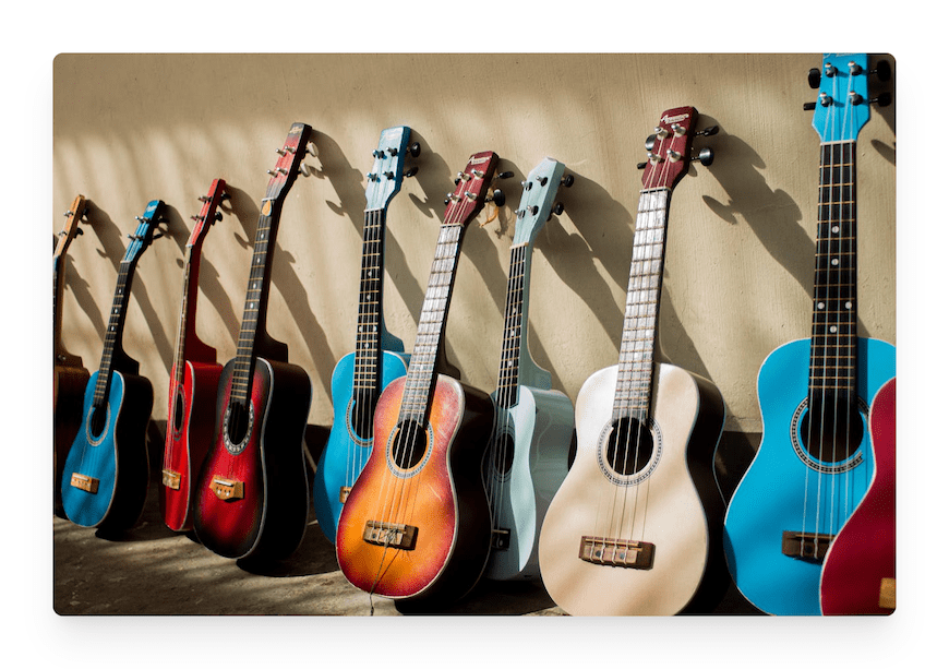 assortment of colorful acoustic guitars