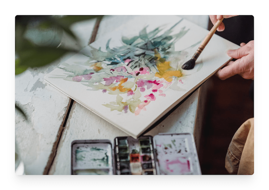 person doing watercolor painting